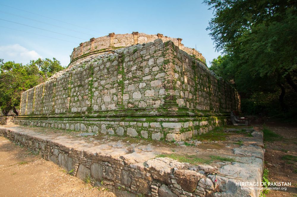 Ancient domed structure rises from its stone platform base.
